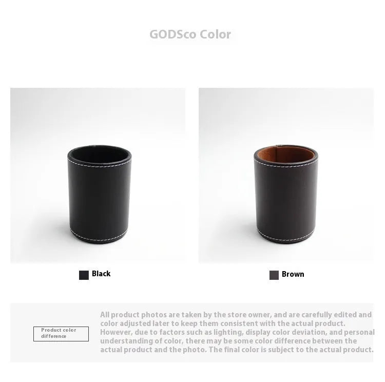 Small round black leather pen container on a desk