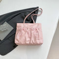 College style bow tote bag in black with double shoulder straps and decorative bow