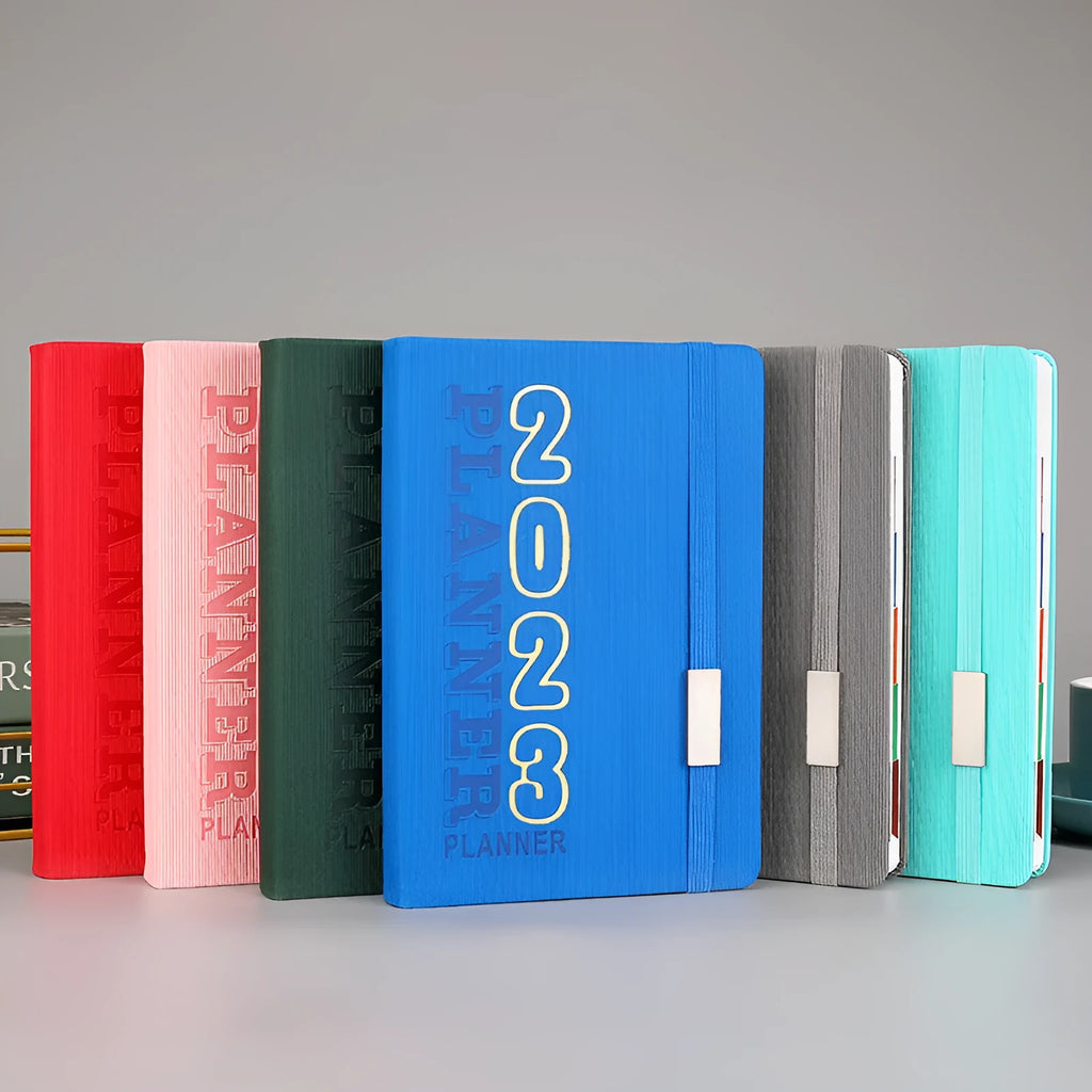 Student almanac calendar notebook with imitation leather cover in one of twelve available numbered styles