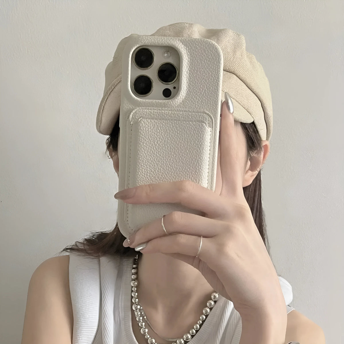 Beige genuine leather phone case with litchi texture for iPhone models 12 to 15 series