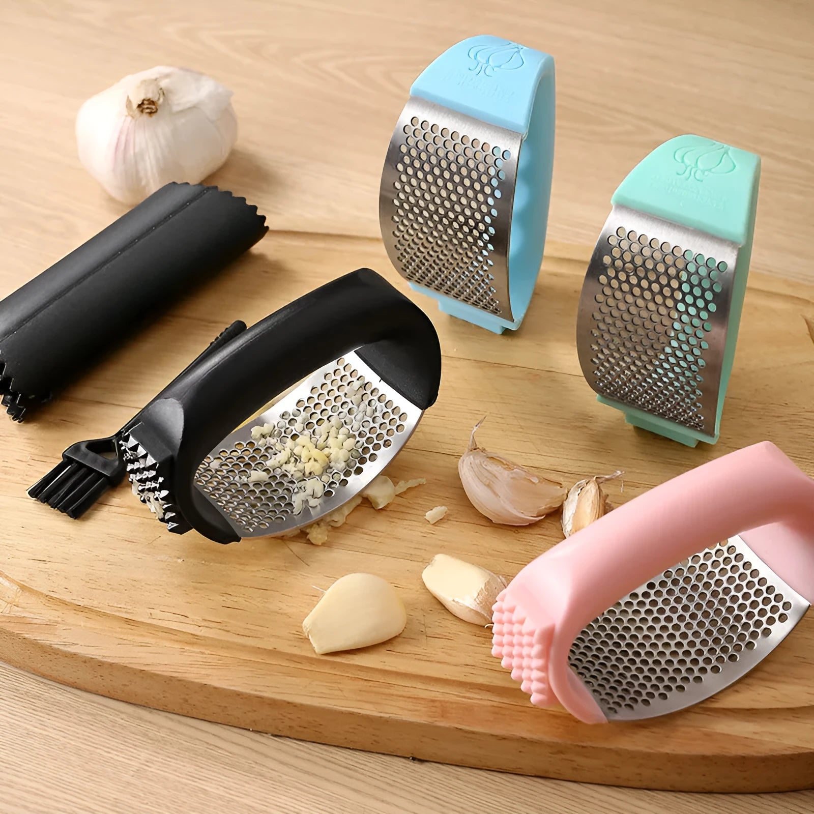 304 stainless steel garlic press in four colour options showing modern design and compact 11 by 7cm dimensions
