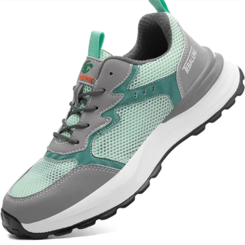 Green low-top safety work shoes with mesh upper panels and a plastic steel toe cap.