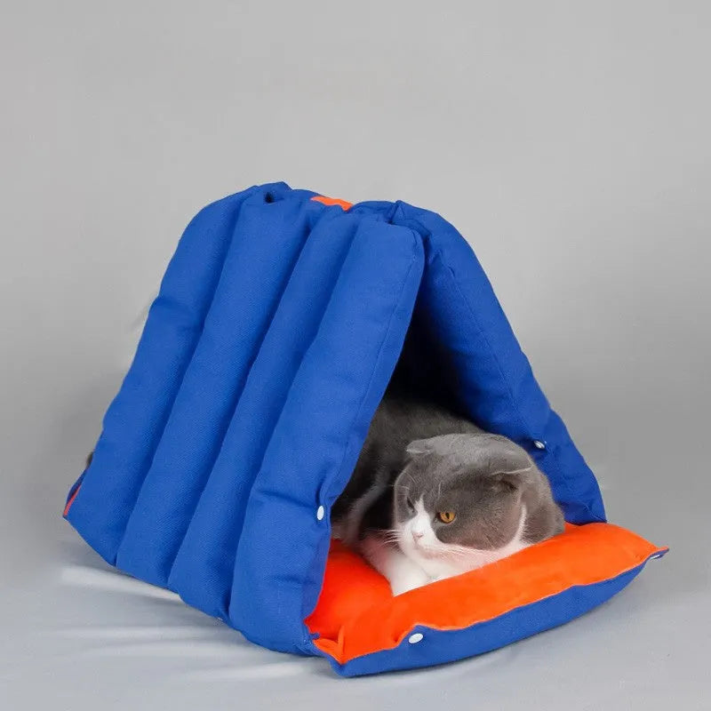 Blue triangular cat nest bed with drilled holes for modular connection and removable cotton cover