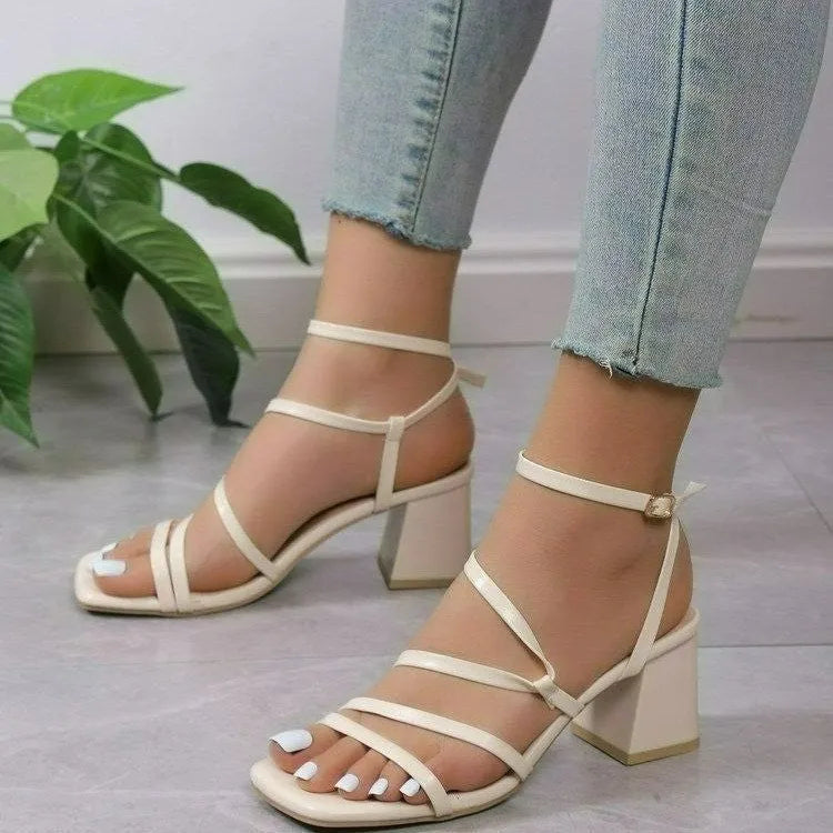 Plus size women's open toe sandal slippers with an ankle buckle strap in rose red, shown on a foot.