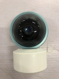White 360-degree rotating indoor Wi-Fi security camera on a table with a UK plug power cord.