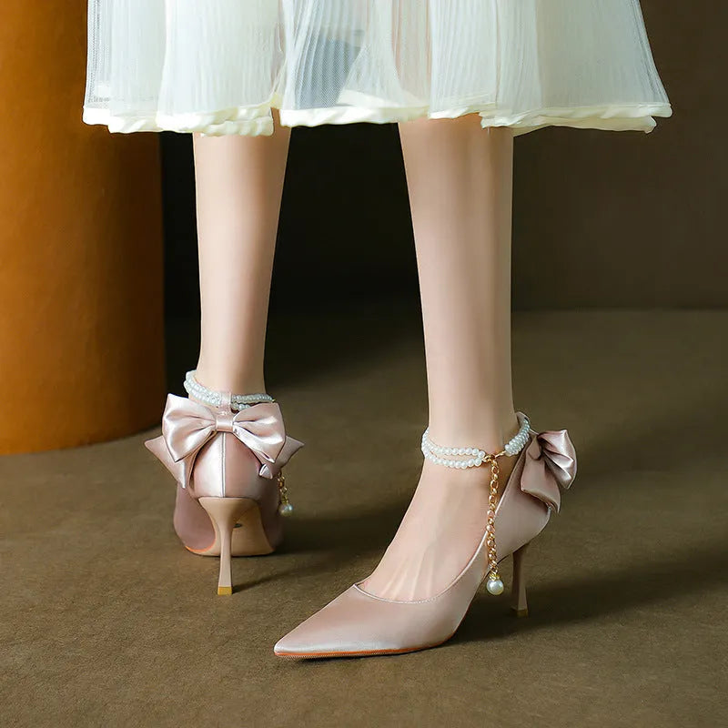Stiletto pointed toe satin pumps with beaded pearl strap in Champagne colour