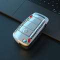 Carbon fibre style car key cover with mirror elements in carbon and white colours