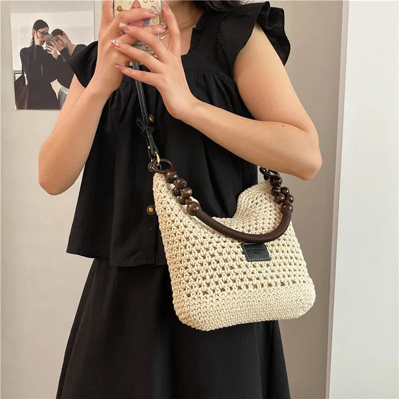 Large knitted beach tote bucket bag in black or brown with zipper compartment and contrasting stitching