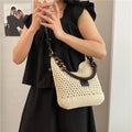 Large knitted beach tote bucket bag in black or brown with zipper compartment and contrasting stitching