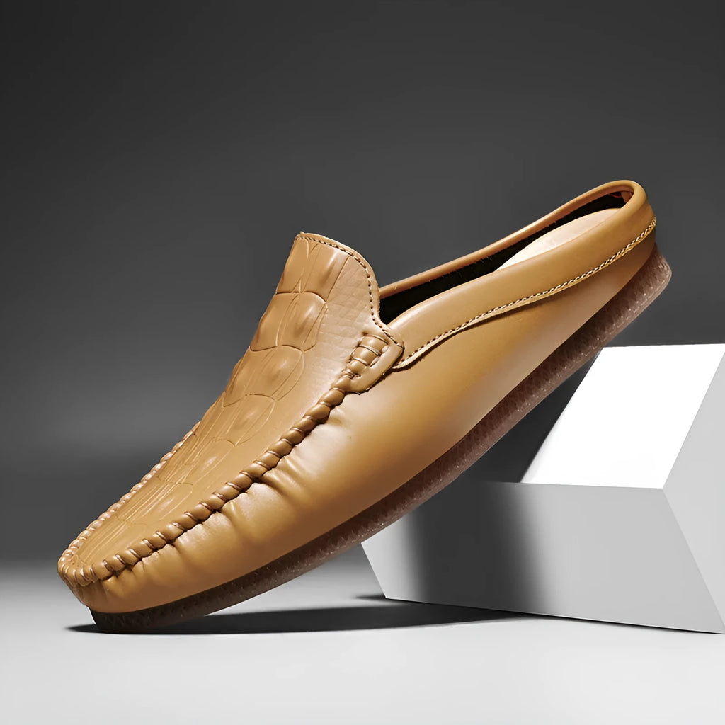 Men's black breathable Gommino semi-slippers with a rubber sole on a plain background