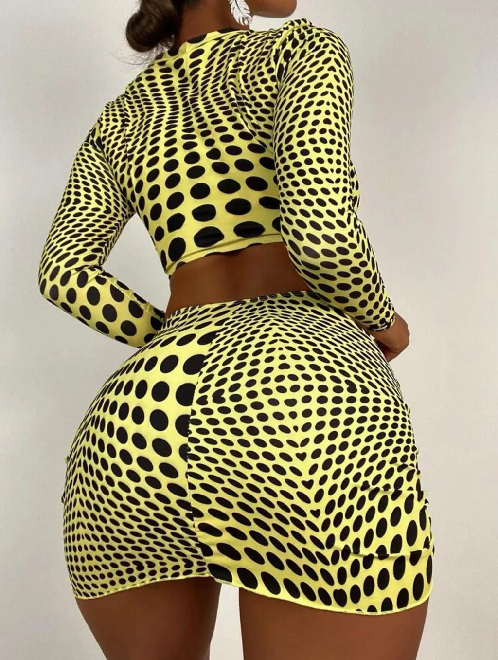 Women's green polka dot swimsuit three-piece set showing top, skirt, and bra