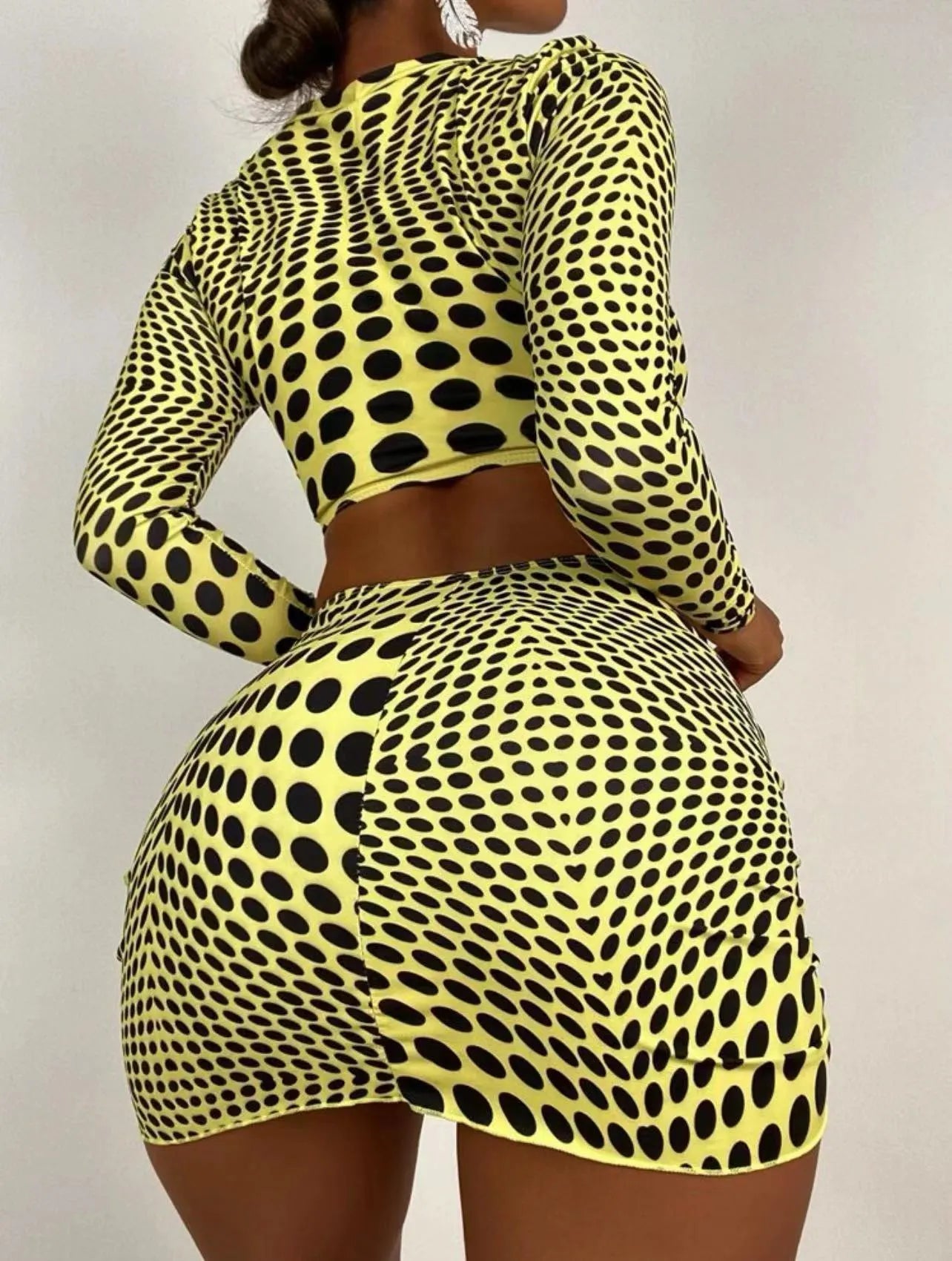 Women's green polka dot swimsuit three-piece set showing top, skirt, and bra