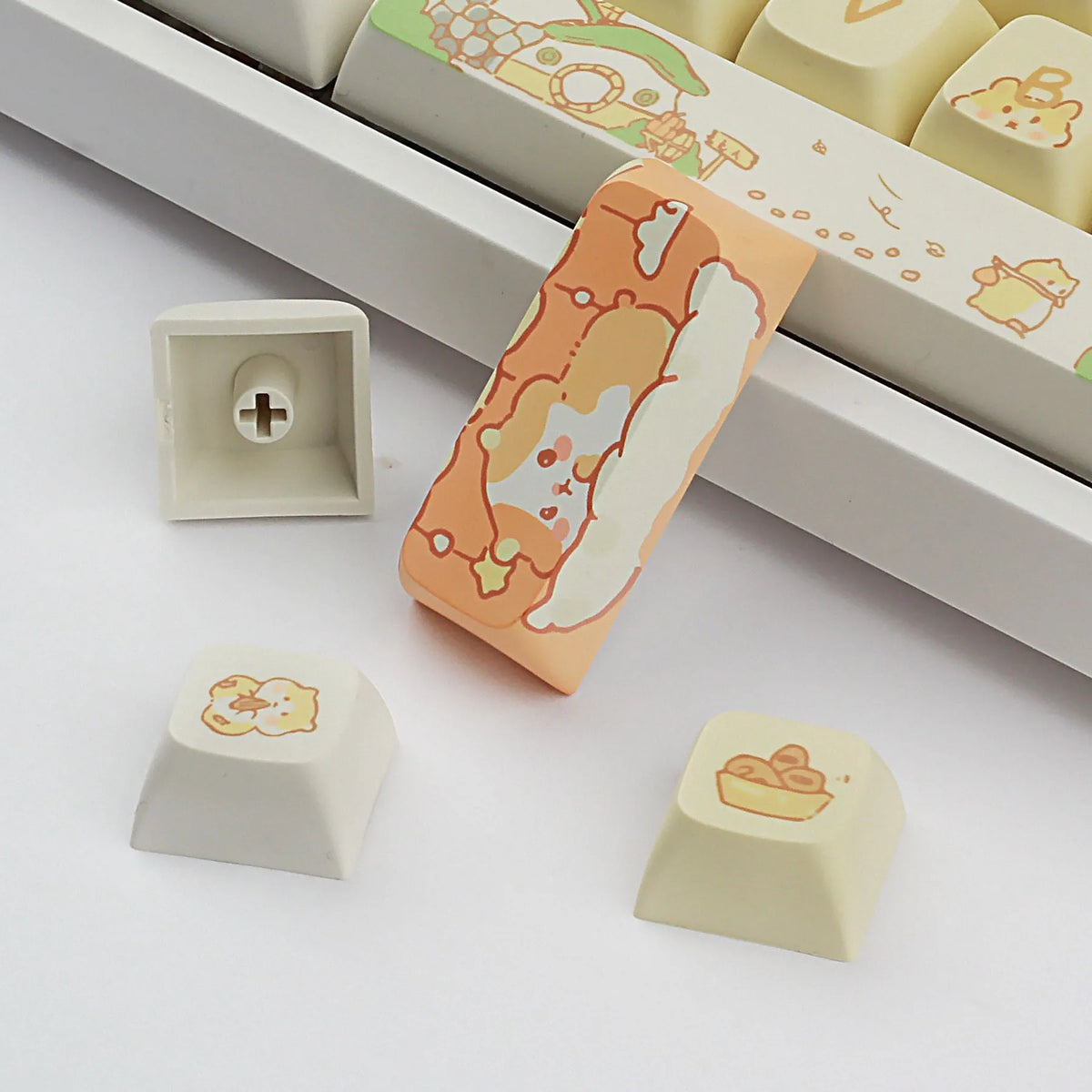 XDA profile mechanical keyboard keycaps in custard colour palette with grey and yellow accents