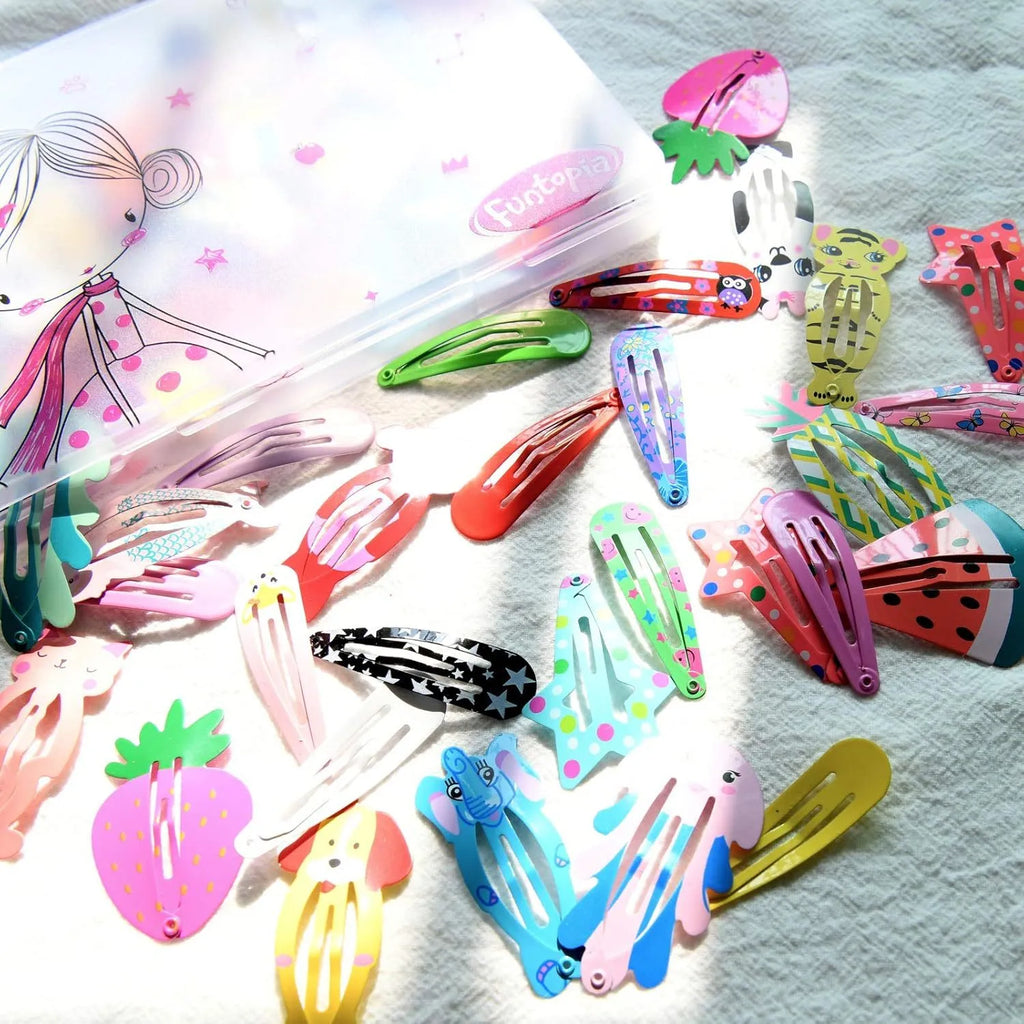 Assortment of 100 metal hair clips in candy colours with cartoon designs of animals, fruits, crowns, and stars.