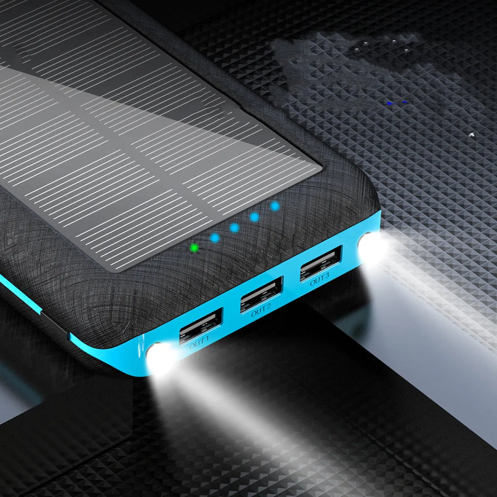 Black portable power bank with wireless Qi charging pad, three USB ports, and LED flashlight for iPhone Samsung Xiaomi phones