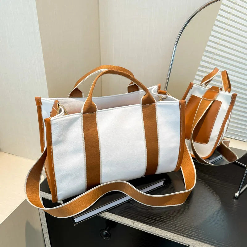 Women's canvas tote bag in horizontal square shape with open pocket, available in black