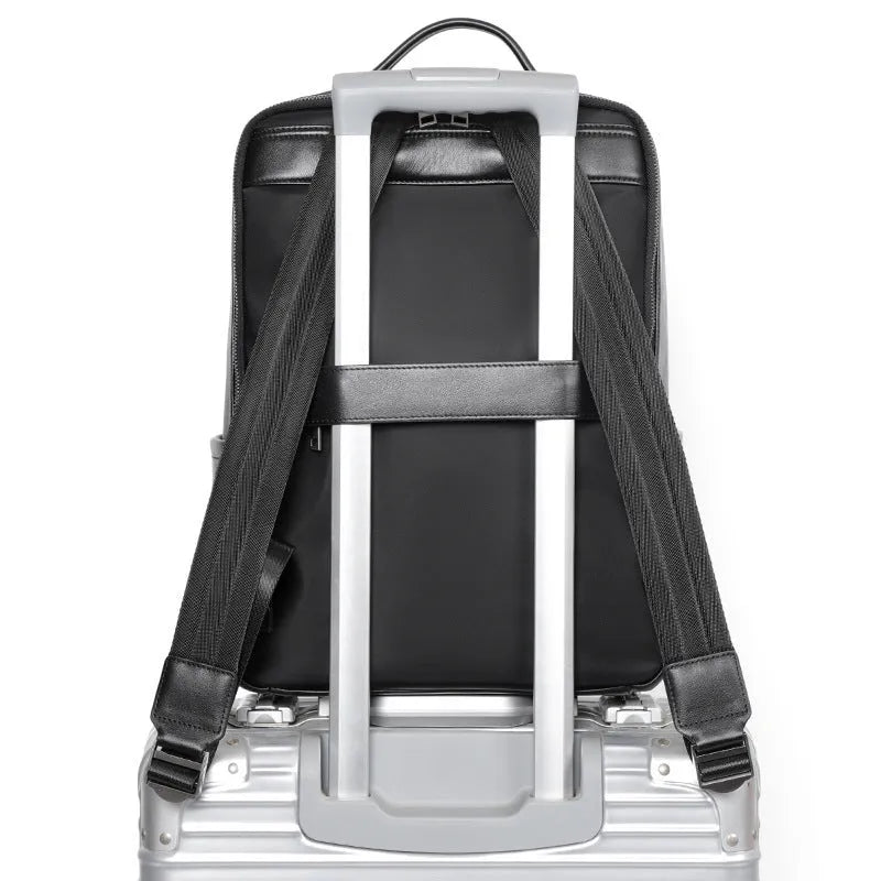 Men's black genuine leather large capacity laptop backpack with weave details.
