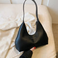 Women's retro style PU shoulder handbag in pillow shape with organised interior compartments
