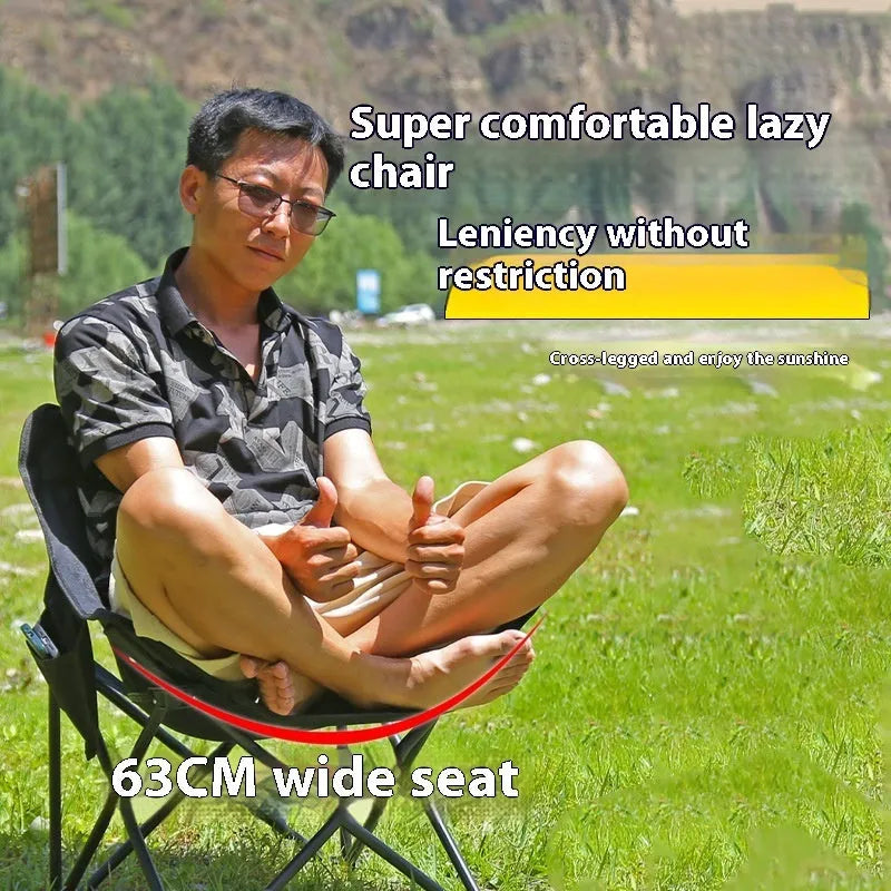 Beige portable folding camping chair with steel frame on grass outdoors