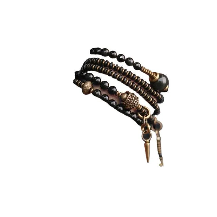 Black multi-layered beaded bracelet with geometric shapes and colourful retro patterns