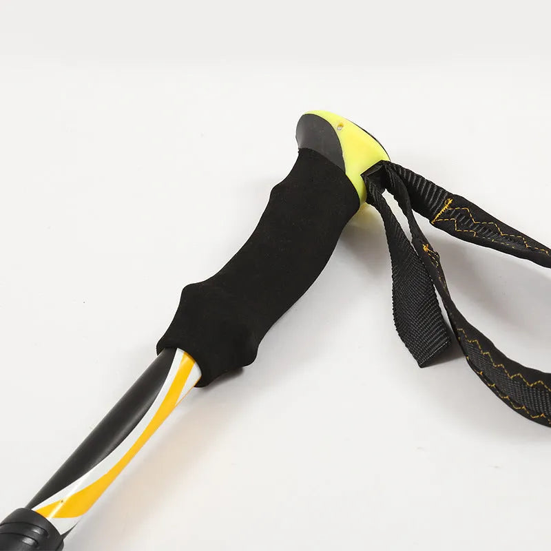 Folding telescopic trekking pole in aluminium alloy, adjustable 36-130cm, shown in black yellow and black blue colour options