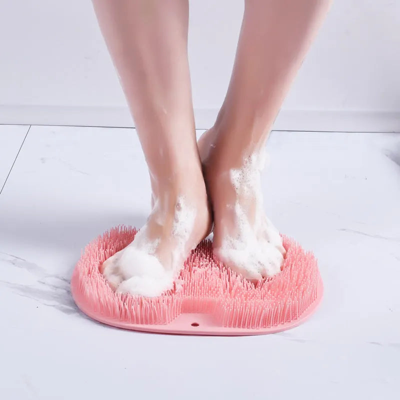 Orange non-slip TPR bath mat with silicone bristles for foot massage and cleaning.