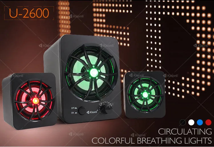 Green 2.1 USB mini computer speaker with colourful LED glowing lights on a desk.