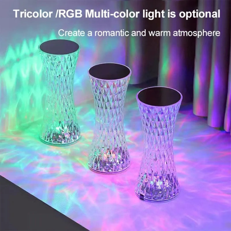 Crystal vase-shaped table lamp with remote control on wooden bedside table
