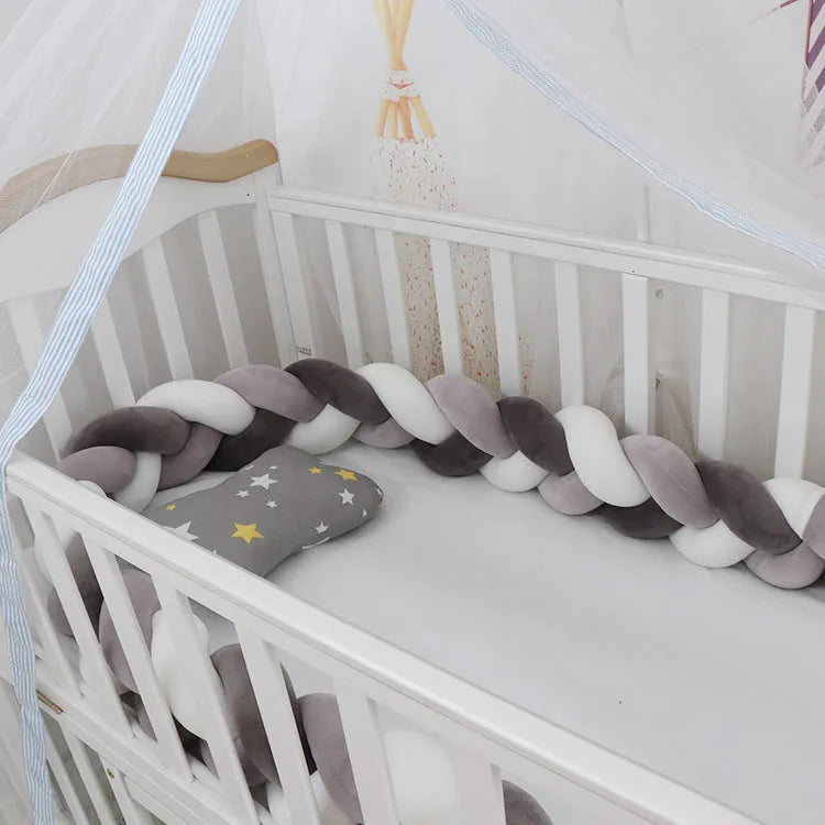 Baby crib bumper braid knot pillow cushion in spandex velvet fabric, shown in a multi-colour option.