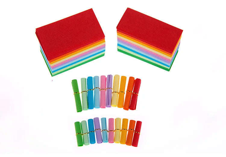 Assorted coloured paper scrolls in small sizes with a metal eyelet for hanging.