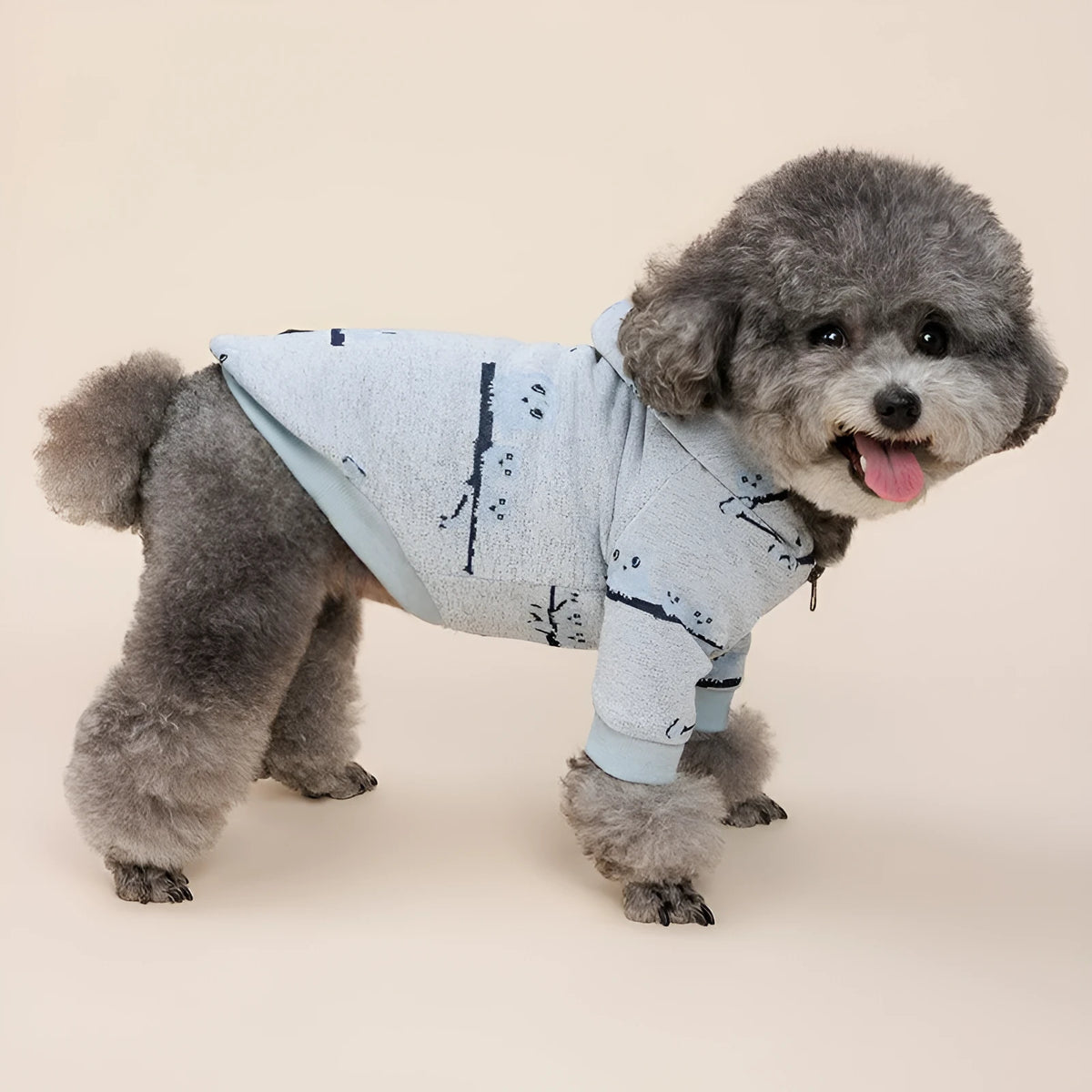 Blue dog sweater with front zipper closure and animal pattern design on mannequin