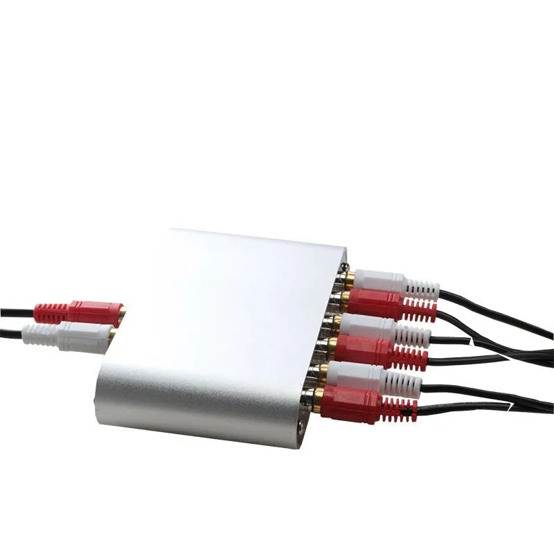 Silver aluminium alloy audio source selector switch unit with front-panel buttons and infrared remote.