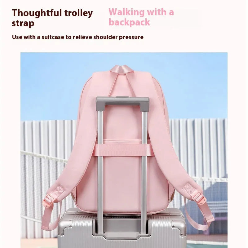 Waterproof pink Oxford cloth girls school backpack with curved straps on a white background.