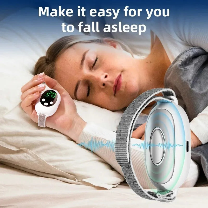 White handheld sleep aid remote control device with USB charging cable and wrist bracelet.