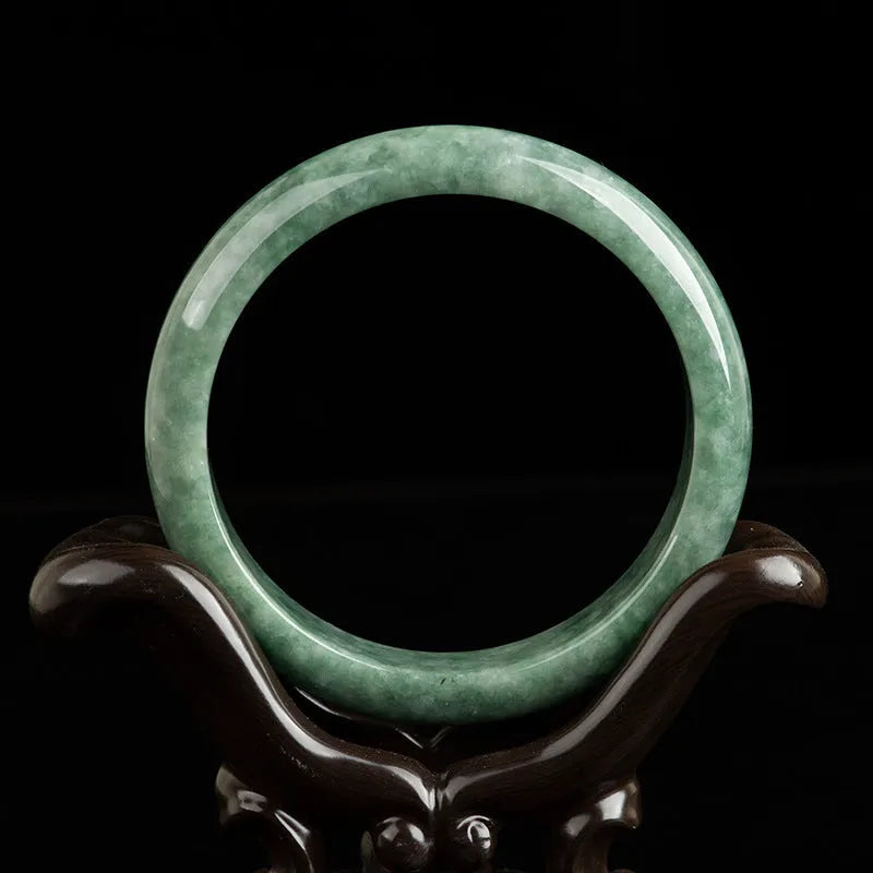 Natural emerald bean green jade beaded bracelet for women on a gift box.