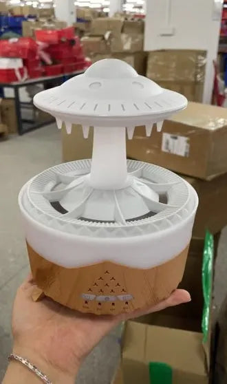 White UFO Raindrop Humidifier with 7-colour nightlight and essential oil diffuser on table