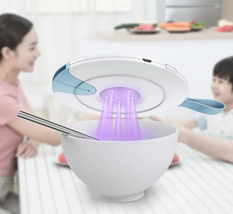 Blue portable UV baby bottle steriliser with USB charging cable on a white background