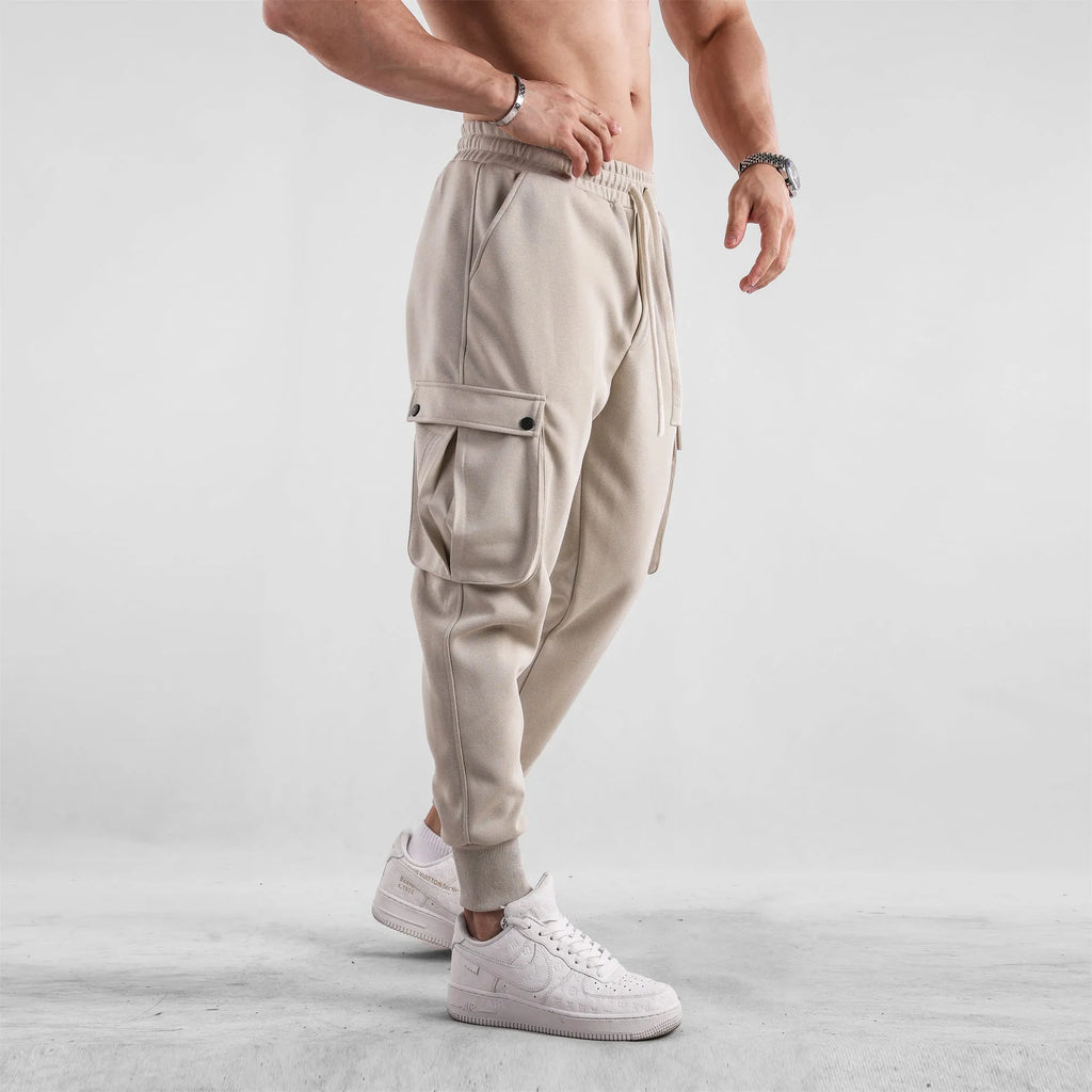 Men's loose cotton sports trousers with ankle ties and multiple pockets in various colours