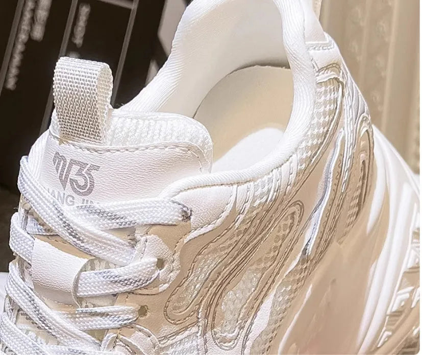 White women's dad shoes with lace-up closure showing round toe design and height increasing insole construction