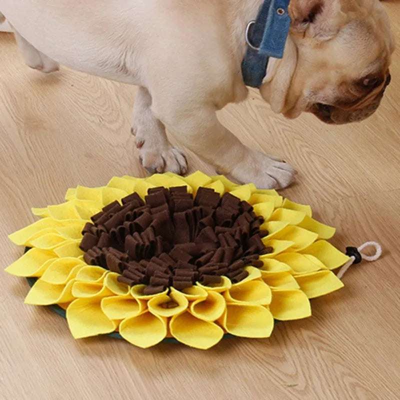 Yellow sunflower-shaped dog snuffle mat with rope and buckle for slow feeding and nosework training.