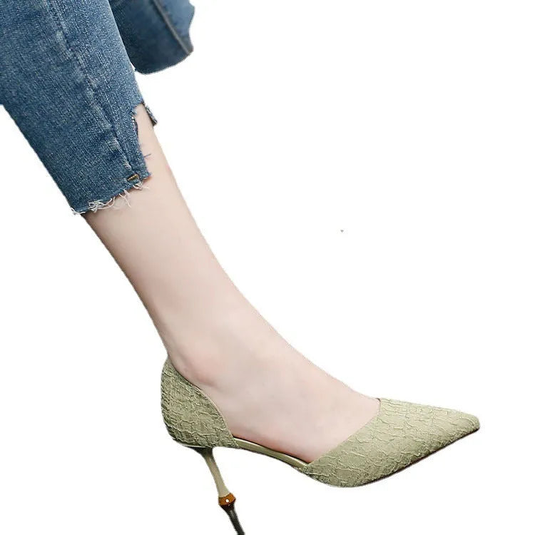Women's black pointed toe stiletto high heels with PU leather upper and thin heel.