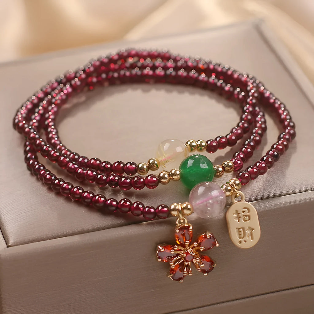 Natural crystal pomegranate red cherry blossom bracelet with sequins on wrist