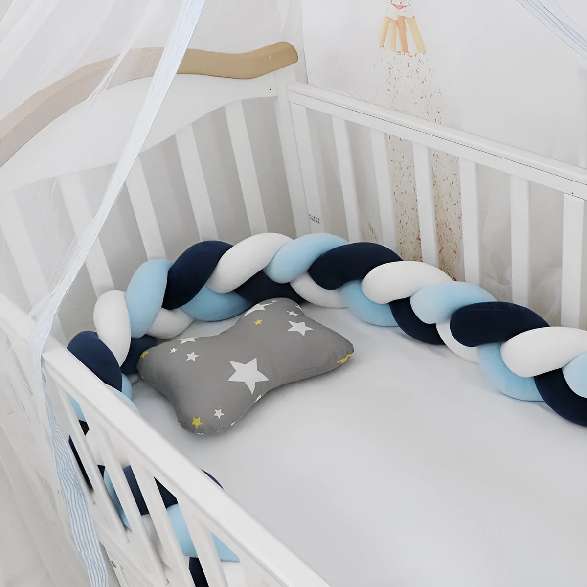 Baby crib bumper braid knot pillow cushion in spandex velvet fabric, shown in a multi-colour option.