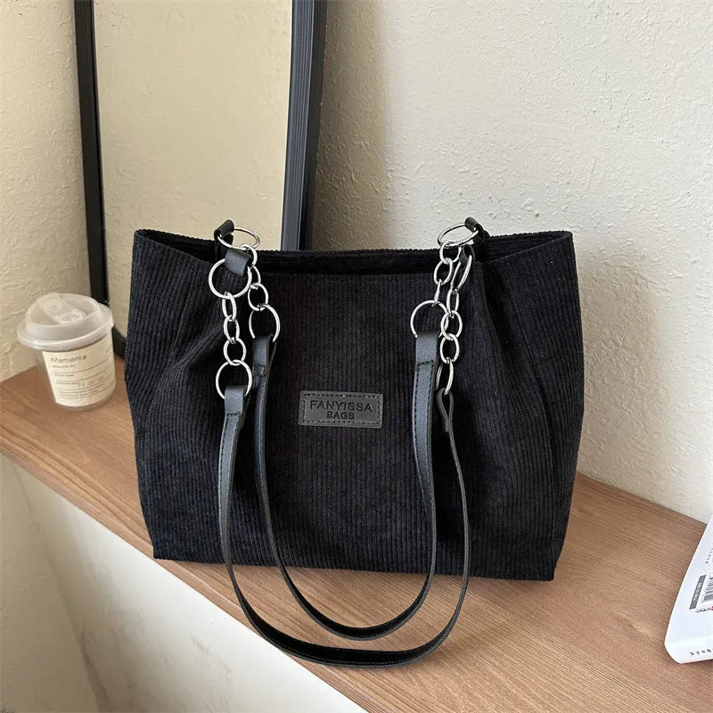 Corduroy one-shoulder tote bag in horizontal square shape with three-dimensional pocket