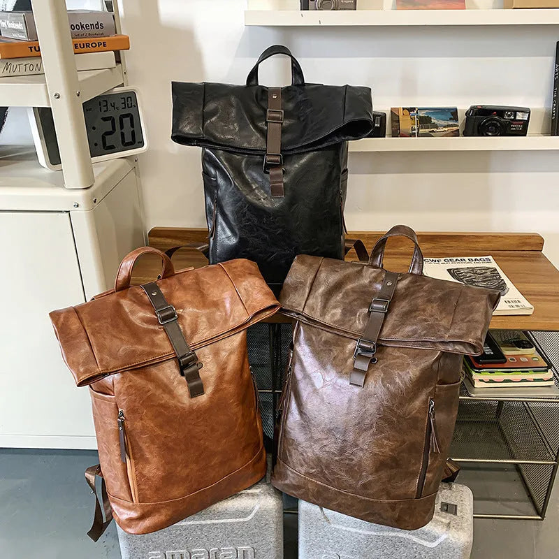 Large capacity PU leather backpack in black, solid colour, with curved shoulder straps and visible sewing line details