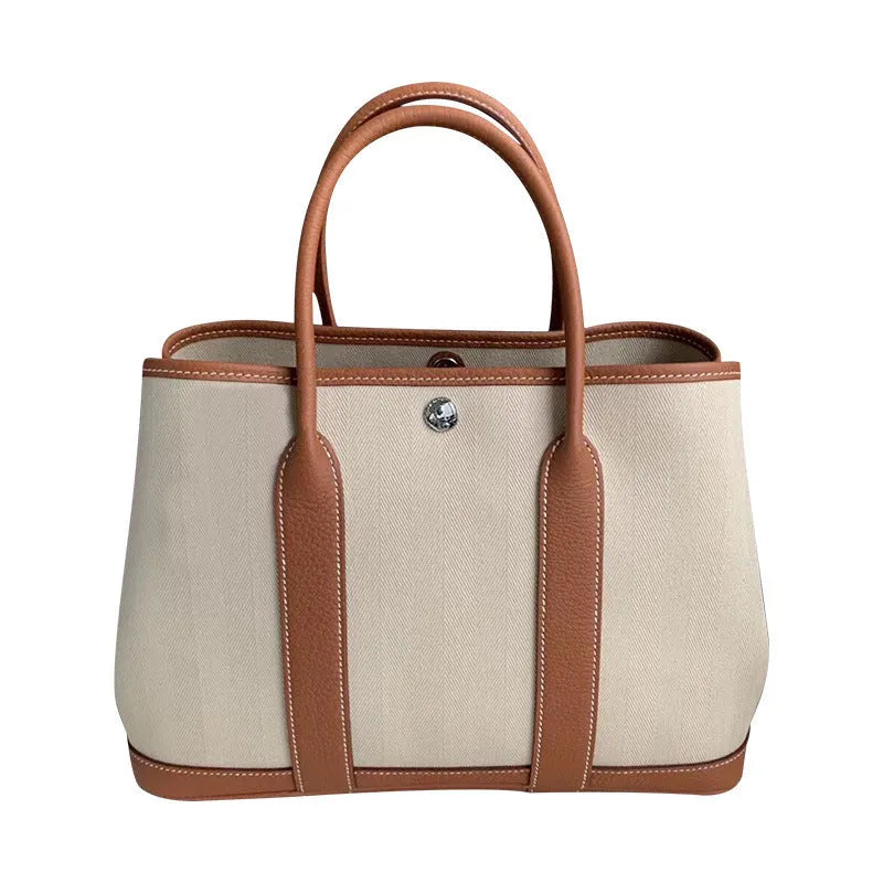 Women's genuine leather crossbody bucket bag showing internal organisation compartments