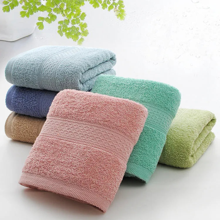 Thickened cotton blend bath and beach towel in apple green, dark blue, dark green, emerald green, light brown, or light pink.