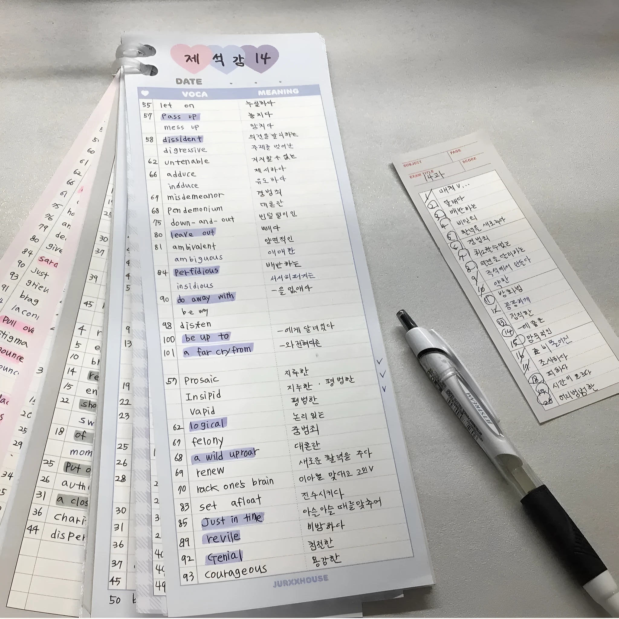 B5 half-size notepad with vertical English words printing in pink, purple, and blue cover colours.