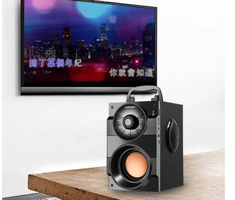 Black portable mini audio system with satellite speakers and subwoofer, 3.5mm cable, and USB power input.