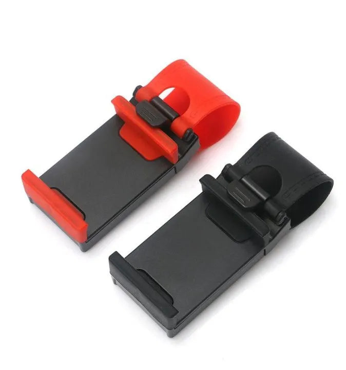 Black steering wheel phone clip mount holding smartphone with soft silicone padding visible